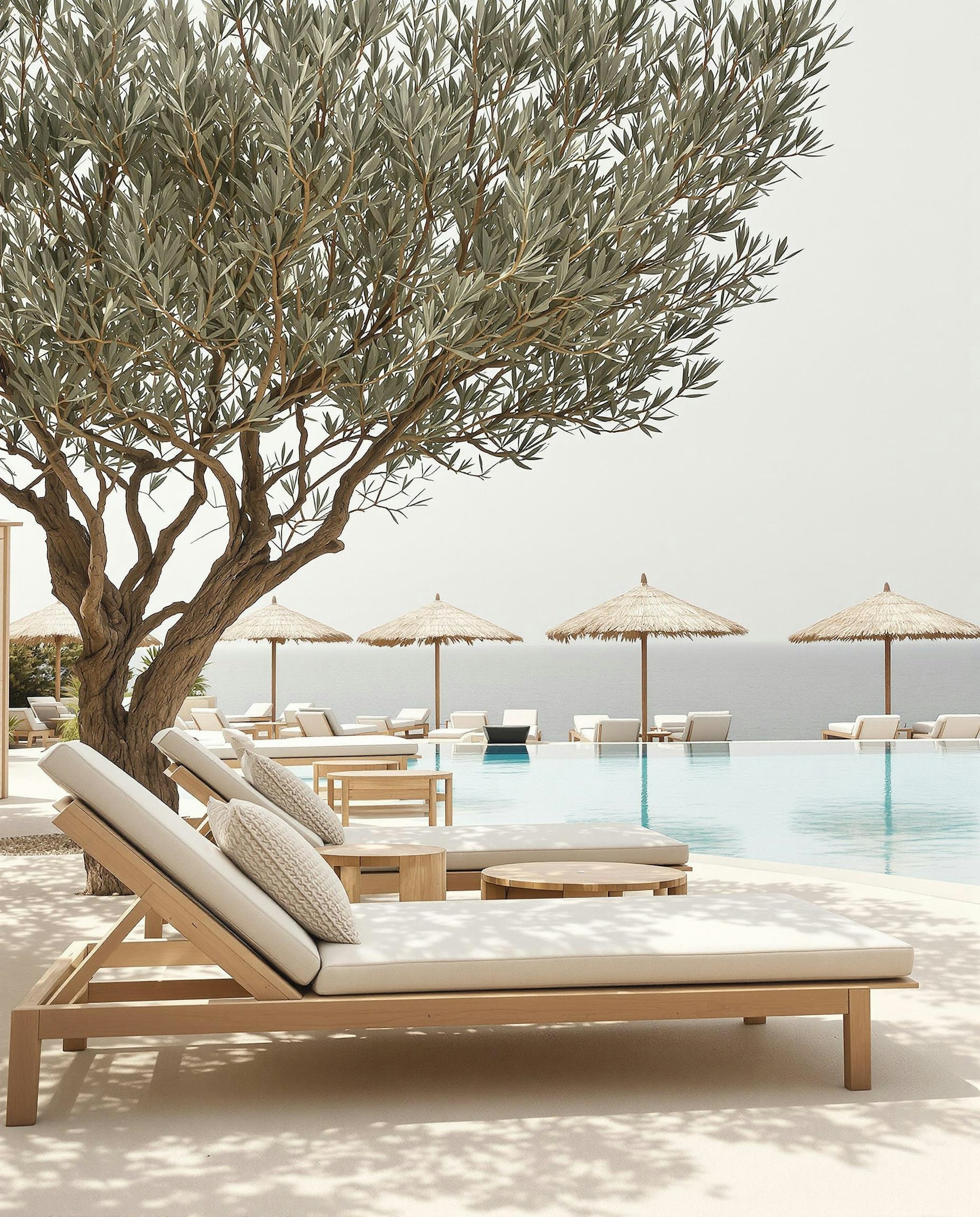 Poolside seating shaded by canvas umbrellas